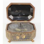 A 19th century Chinese export gilt lacquer tea caddy of octagonal form, the hinged lid opening to