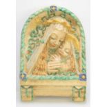 A pottery plaque of the Madonna and Child in the Della Robbia manner, 36 by 24cm.
