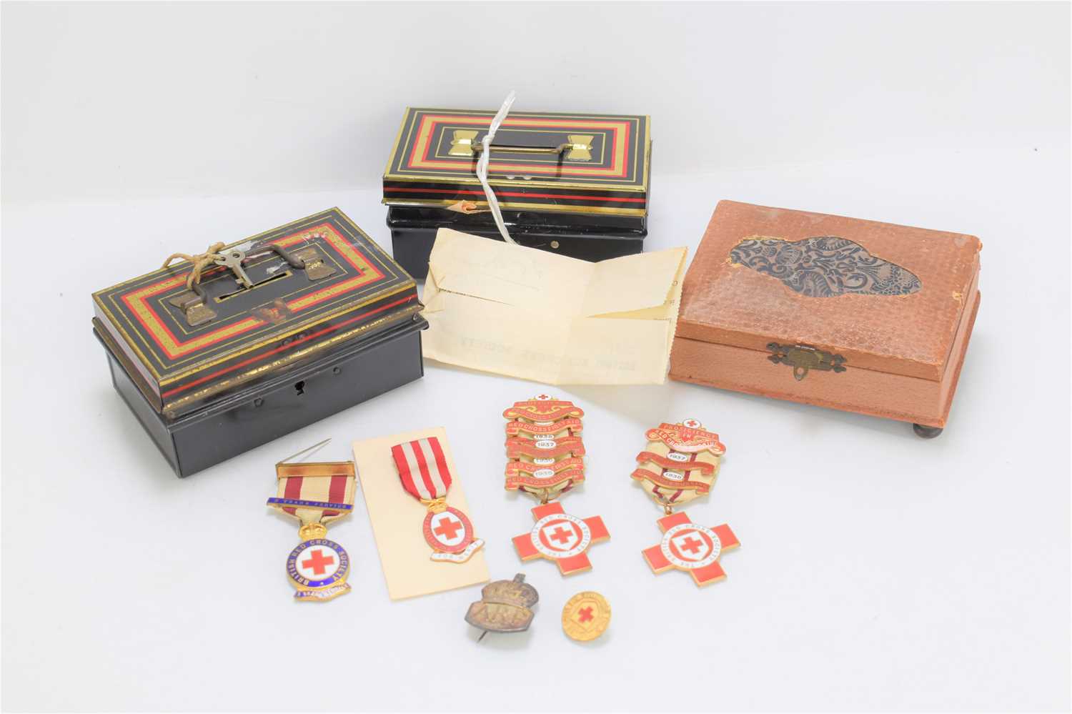 A group of 1930s British Red Cross proficiency medals awarded to M. Squirrel, made by J.R Gaunt