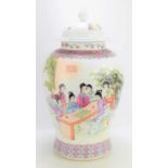 A 20th century Famille Rose large ginger jar, painted with a scene of of ladies in an interior