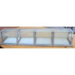 A vintage aluminium and glass counter-top display cabinet, 150cm in length.