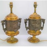 A pair of mid 20th century table lamps, of classical form, with central banded frieze of