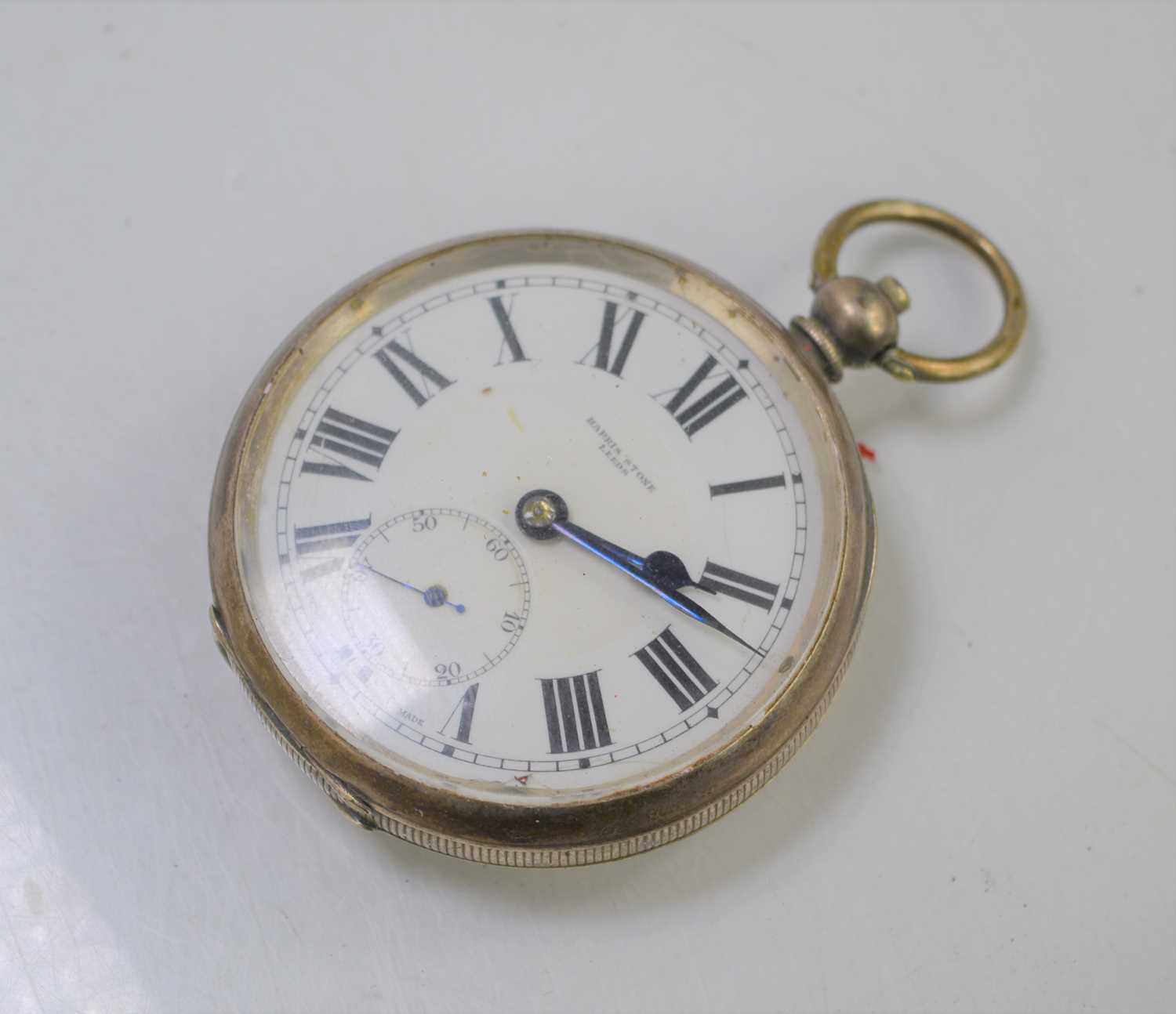 An early 20th century Harris Stone of Leeds open faced silver pocket watch, with Roman numeral