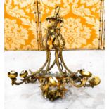 A gilt brass French chandelier, composed of six downswept branches of scrolling foliate form. A/F