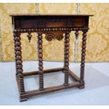 An 18th century walnut side table, with frieze drawer, and bobbin turned legs and peripheral