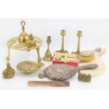 A group of metalware to include an Edwardian brass trivet, candlesticks, silver mounted comb and