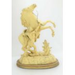 A late 19th / early 20th century spelter sculpture of boy and rearing horse.
