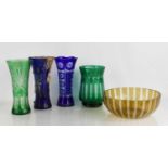 A group of Bohemian coloured glass to include four vases and a bowl, 24cm diameter.