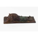 A 19th or early 20th century bronze sculpture of a lion, with makers or foundry stamp between