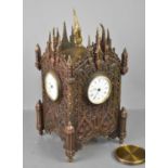 A Henry Marc gothic style brass four sided table clock, the Gothic tracery architectural sides all