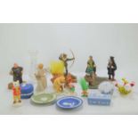 A group of collectible items to include a Beswick Rupert the bear figure, glass paperweight,