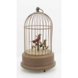 An early 20th century bird cage clockwork automaton with two singing birds,28cm high Condition