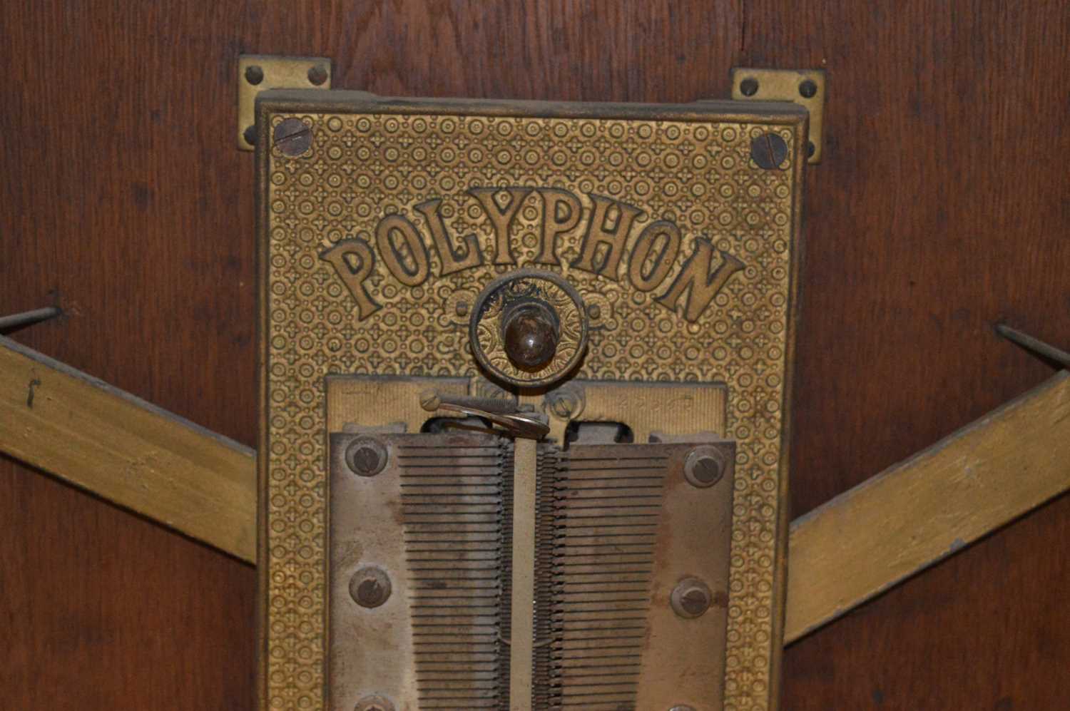 A late 19th century mahogany cased "Penny in the Slot" Polyphon music box on associated mahogany - Image 18 of 19