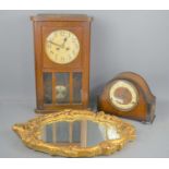 An Art Deco oak cased mantle clock together with an oak cased wall clock and gold framed wall