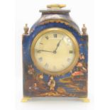 An early 20th century French chinoiserie mantle clock decorated with figural landscape on blue