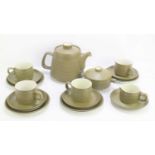 A Denby part tea set comprising teapot, cups, saucers and milk jug.