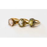 A group of three 9ct gold dress rings, comprising one set with large oval cut rose quartz, 14 by