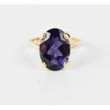 A 9ct gold, oval iolite ring, the iolite measures 15 by 9mm, size N, 3.2g.