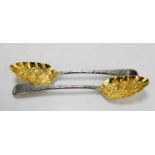 A pair of William and Peter Bateman berry spoons, with flowers in relief to the silver gilt bowls,