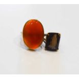 Two 9ct gold rings, one set with a large oval carnelian 24.7 by 17.4mm, size N, 7.82g, the other set