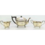 A Silver tea set comprising teapot, sugar bowl and milk jug, 29.4toz, hallmarked for Sheffield 1935