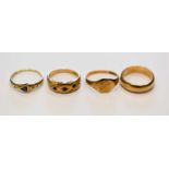 A group of three 9ct gold rings comprising a wedding band, size M, small signet ring, size K, and