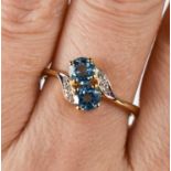 A 9ct gold, blue topaz and diamond ring, size S.