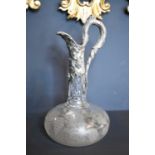 A fine 19th century silver mounted claret jug, with fine floral etching to the circular bowl,