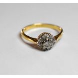 An 18ct gold and diamond cluster ring, London 1962, size O, 3g.