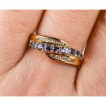 A 9ct gold, tanzanite and diamond ring, size S.