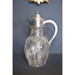 A silver and cut glass claret jug, the heavy cut glass etched with floral design, Chester 1912, 28cm