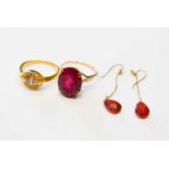 A group 14ct gold jewellery comprising a pair of earrings with teardrop cut garnet drops, a ring set