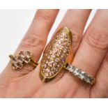 A group of three 9ct gold rings, comprising a ring of elongated marquise form, set with rose quartz,