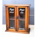 An Edwardian display cabinet, the mahogany case having two glazed doors with later lettering 'Fry'