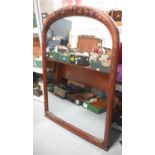 A Victorian style mahogany wall / overmantle mirror, with carved decoration, 147 by 103cm,