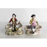 A pair of Volkstedt Continental porcelain salts, each with an 18th century style seated boy