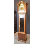 A reproduction oak cased grandmother clock, with Roman numeral dial and Tempus Fugit inscription.