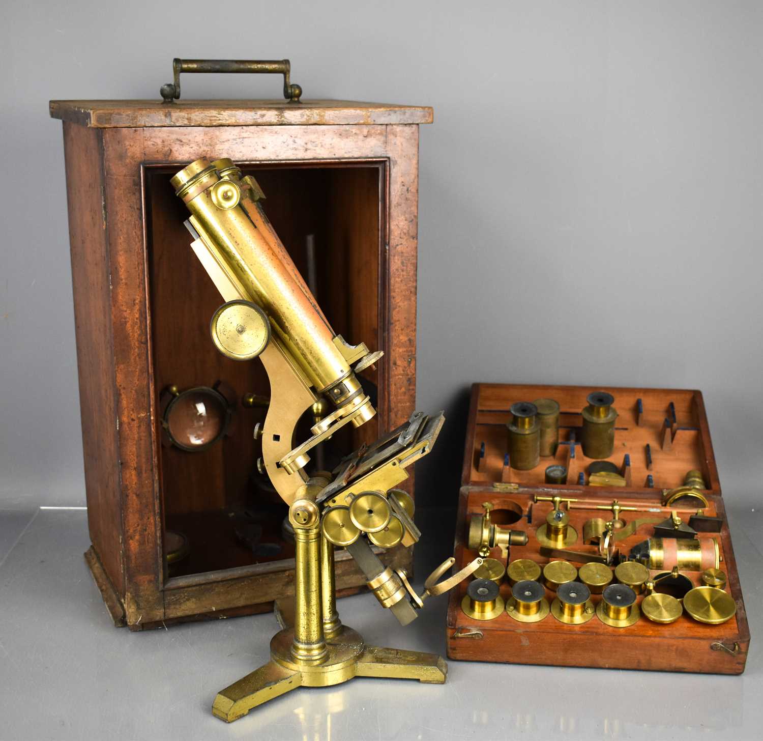 A 19th century Smith & Beck binocular Microscope in a mahogany case, the case holding a large