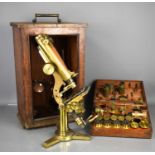 A 19th century Smith & Beck binocular Microscope in a mahogany case, the case holding a large