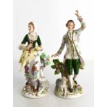 A pair of Sitzendorf figures of a shepherd and shepherdess in the Dresden style.(2)