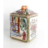 A Chinese pottery four tier rice / food box, the cover enamelled with floral and butterfly