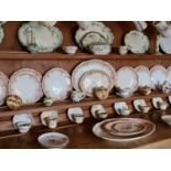 A large quantity of Victorian dinnerware, to include plates, cups, platters.