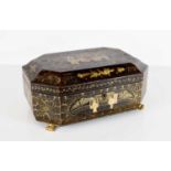 A 19th century black lacquered Chinoiserie sewing box, decorated with gilded architectural scenes,