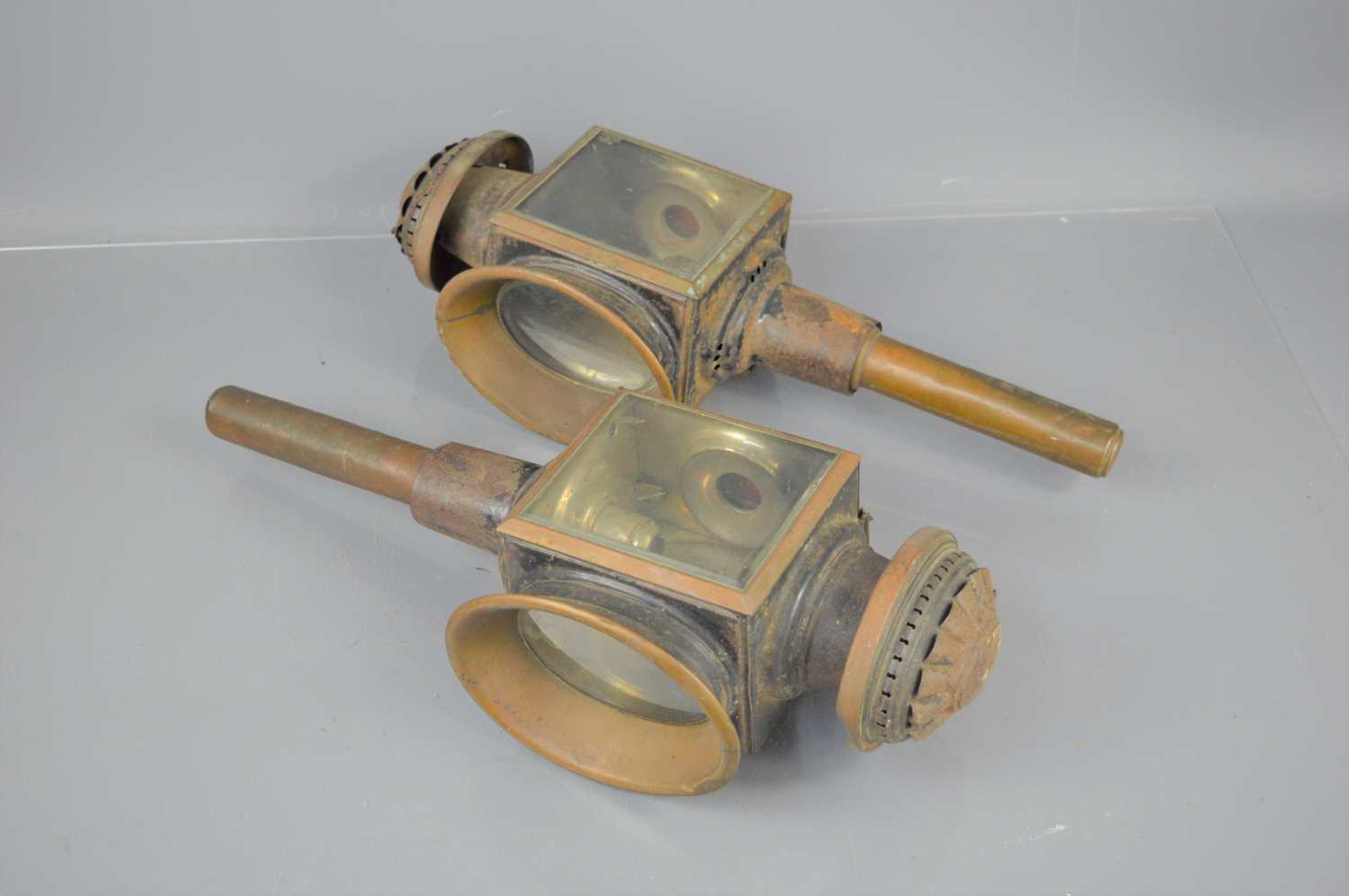 Two Victorian carriage lamps with bevelled glass, Barnett Thrapston marked on candle holder.