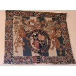 A tapestry panel depicting heraldic crest, 140cm by 130cm
