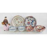 A Royal Doulton figure of the Orange Seller, together with three Chinese porcelain plates, a pair of