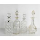 Four cut glass decanters one by Royal Doulton all with original stoppers.