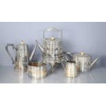 A Walker and Hall silver plated tea and coffee set, of fluted form with pineapple finials,
