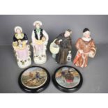 A pair of framed Prattware lids, together with two Victorian figurines, a nodding Monk, and
