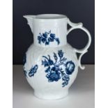 An 18th century Worcester sparrow beak jug, blue and white, decorated with flowers, blue crescent